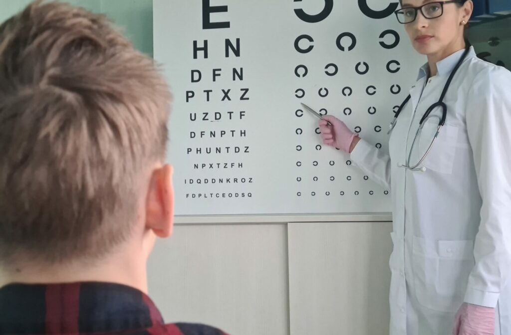 A child taking an eye test to determine what prescription they need for their myopia.