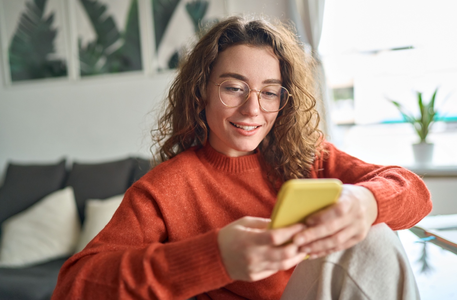 Young woman in her 20s wearing glasses.